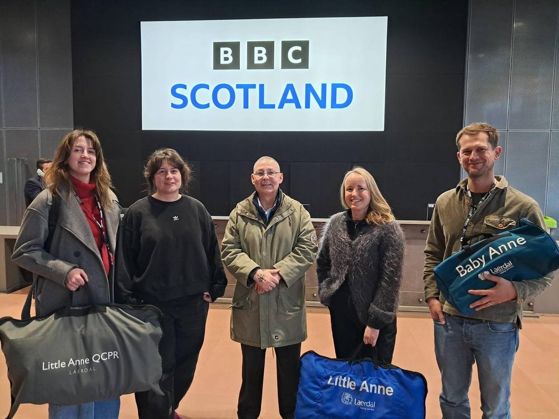 Delegates with training manikins after an on-site first aid course delivered at BBC Scotland